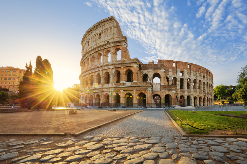 View of Colosseum in Rome and morning sun, Italy, Europe.