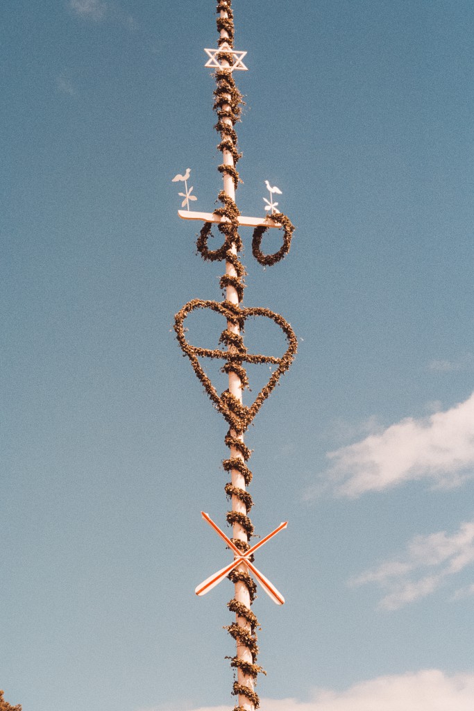 A maypole decorated with flowers for Midsommar