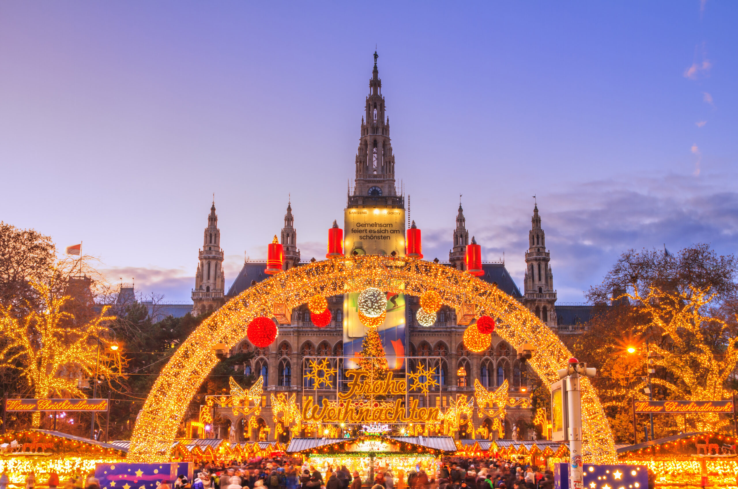 Festive cityscape - view of the Vienna Christmas World and Vienna City Hall (Wiener Rathaus) on Rathausplatz